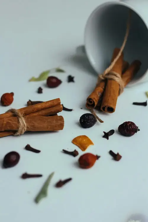 Multiple spices across the table, ready to be turned an aromatic spice blend.